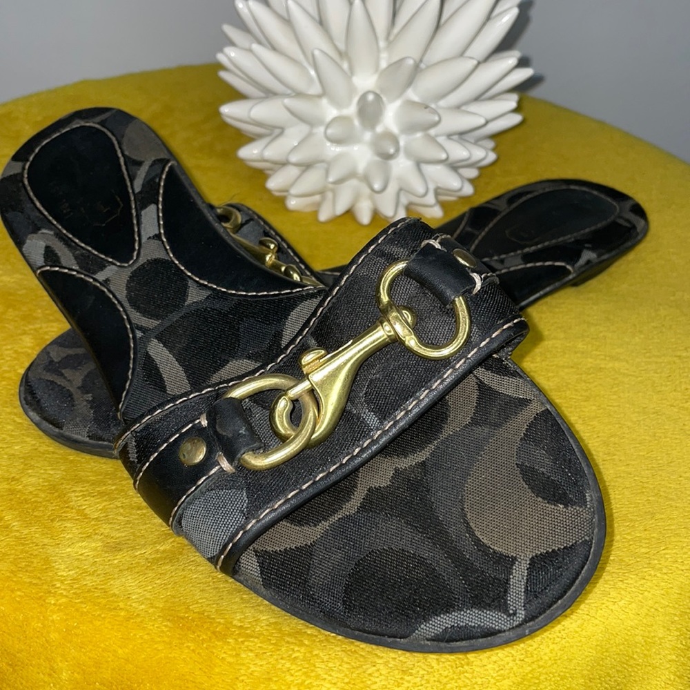 Coach slip ons With clasp detail.